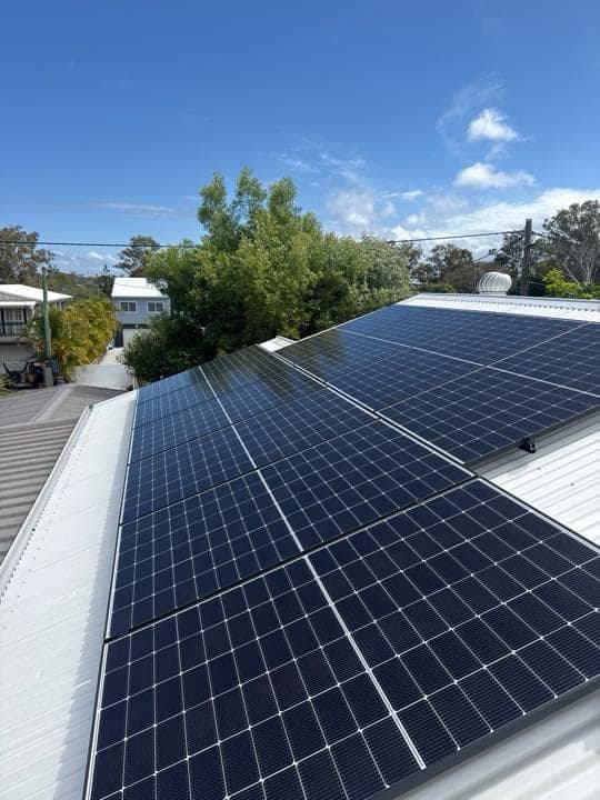 Rooftop solar panel array on a tile roof